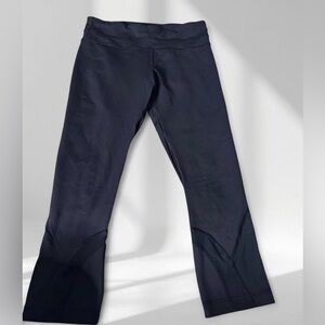 Lululemon capri leggings with a back zip closure.